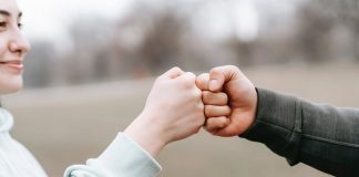 couple fist bumping