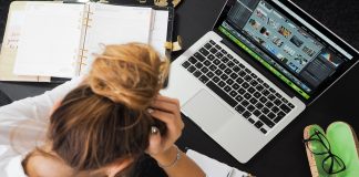 stressed lady with hands in head working