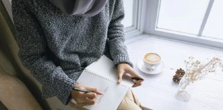 woman taking notes on health
