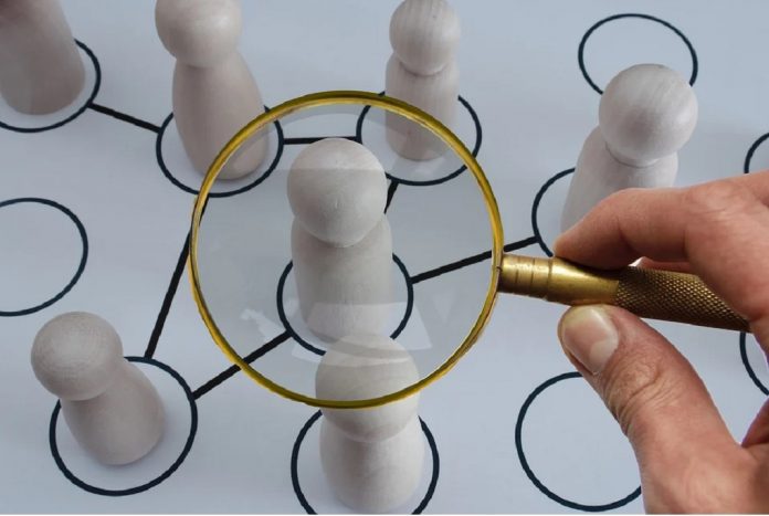 Magnifying glass identifying contacts