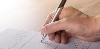 person filling out survey form