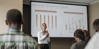 woman presenting with microphone in hand