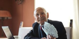 boss with hand full of cash handing to you