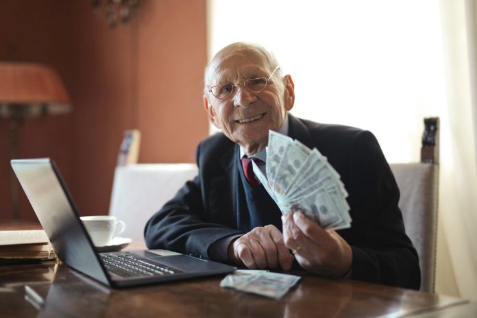 boss with hand full of cash handing to you