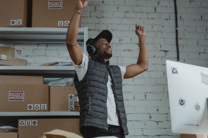 man with headphones enjoying work