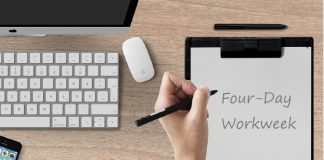 notepad with Four-Day Workweek written on page