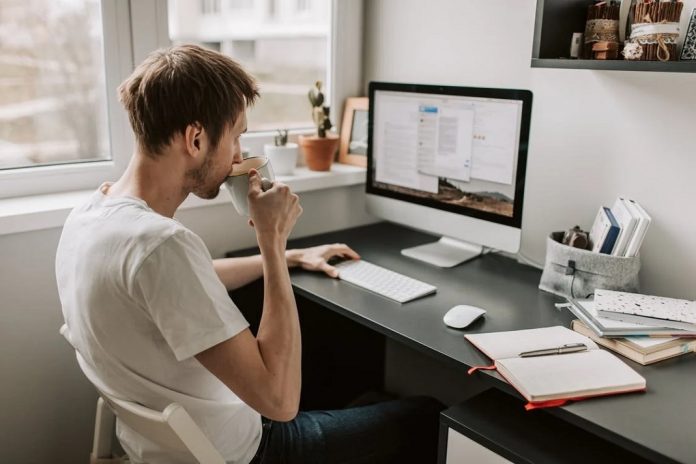 remote worker sitting at work station