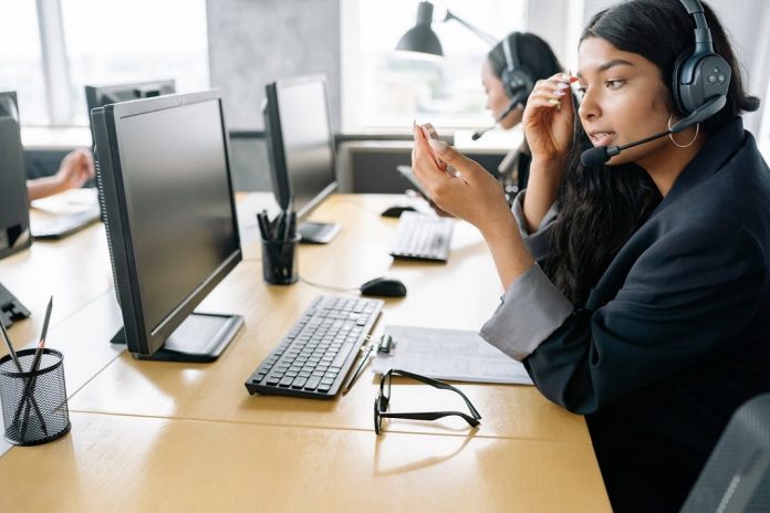 employee sitting at computer screen