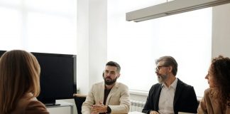 candidate with interviewers in office