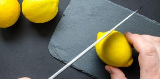 small part of lemon being cut off