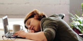 female employee asleep at her desk