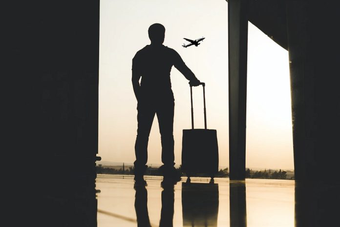 man waiting at airport