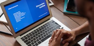 person doing online course on laptop