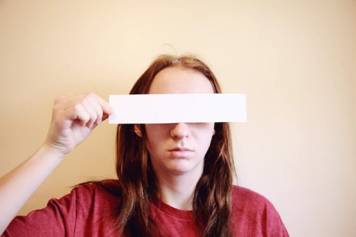 woman hiding her identity