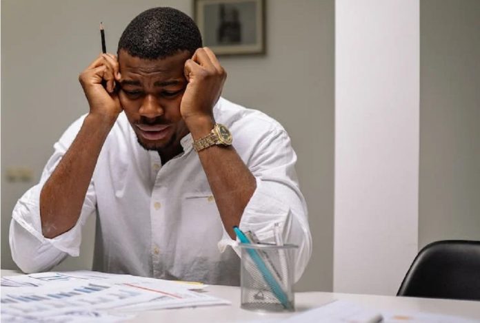 depressed man at workstation