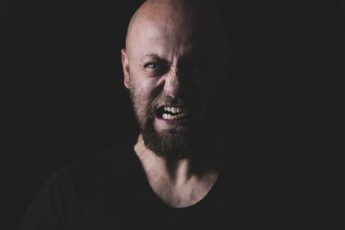 angry bald man with beard
