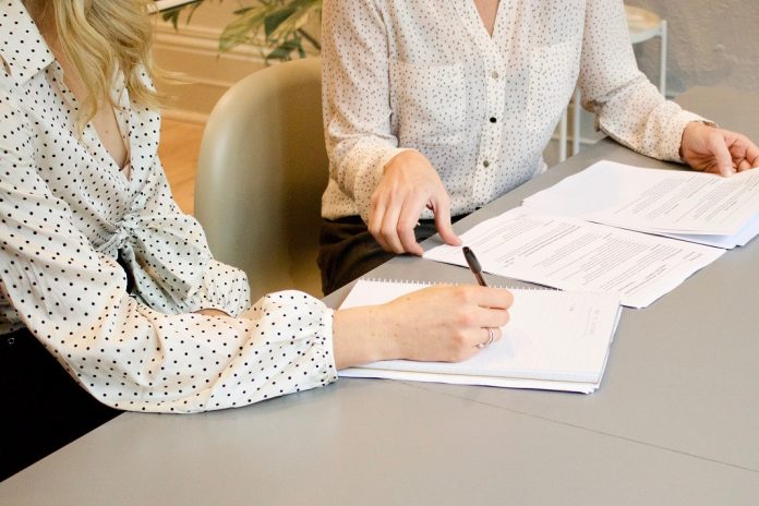 employee signing employment contract