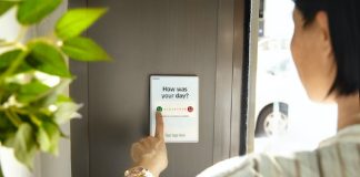 employee compelting digital "how was your day?" survey