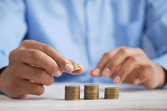 Man counting euro coins.