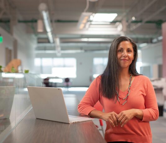 Woman worker at stamding desk